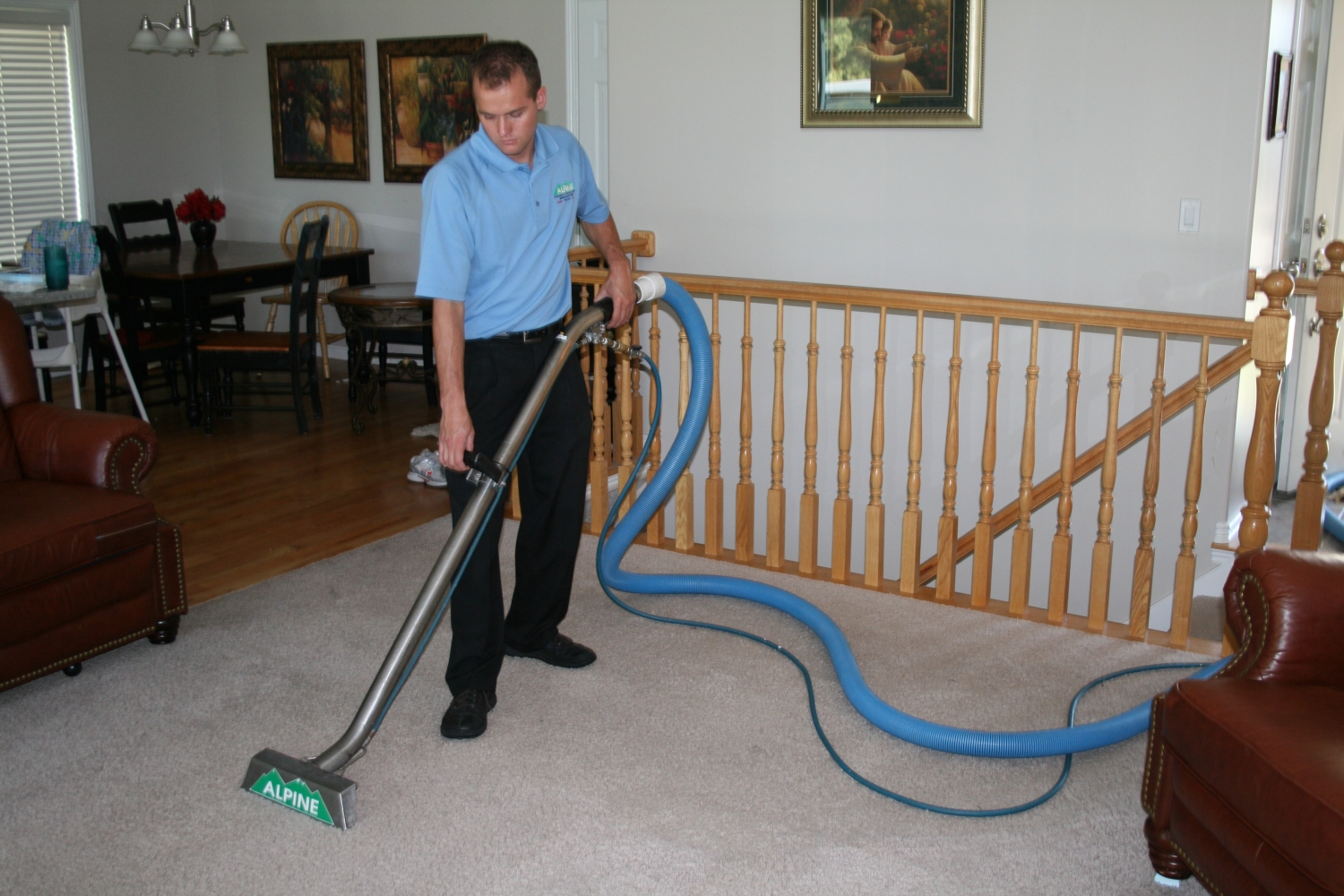Alpine Cleaning and Restoration Team Member Cleaning Carpet