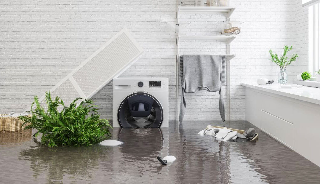 Flooded laundry room with water damage and fallen shelf